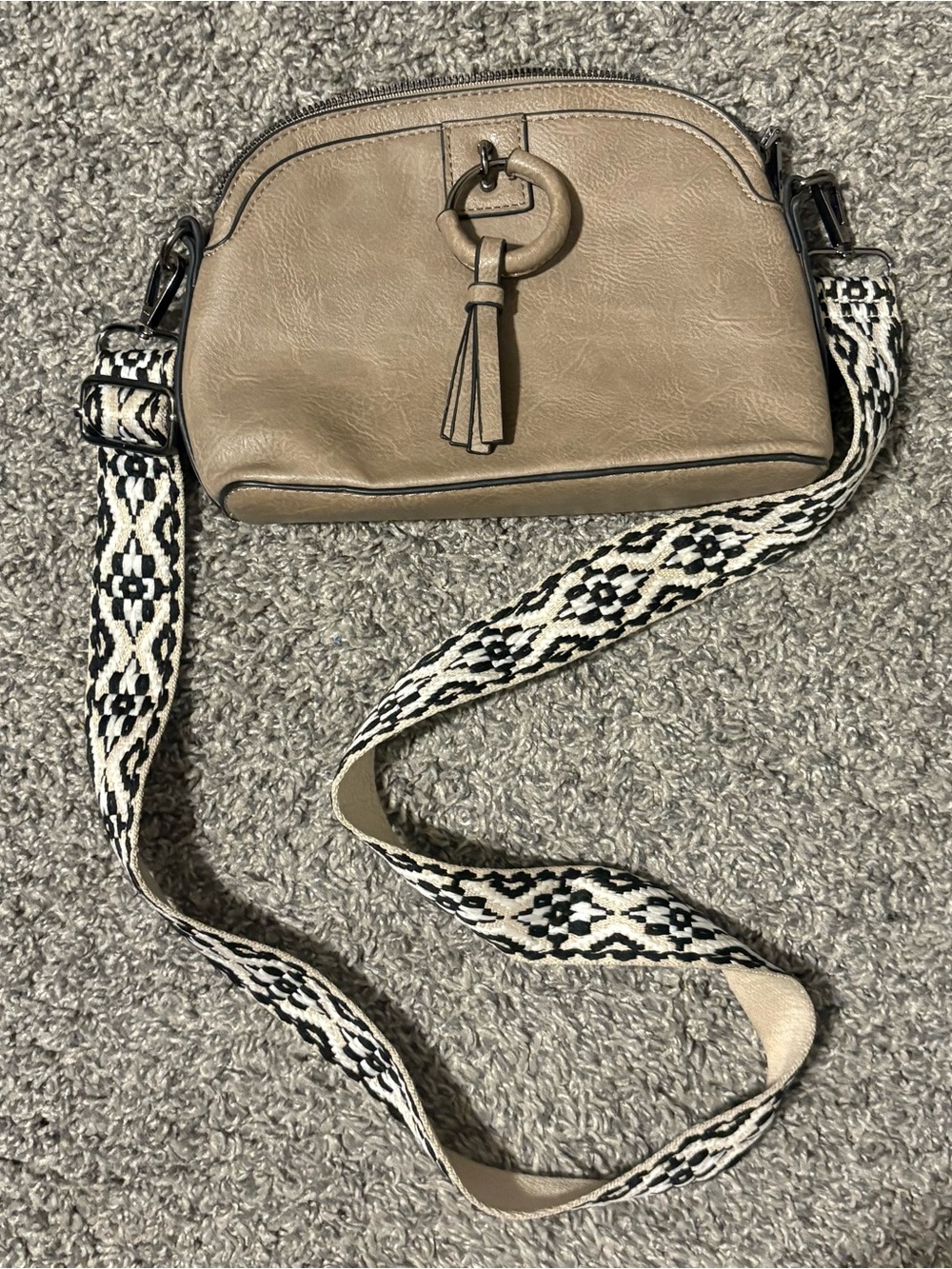 Taupe Crossbody Bag with Decorative Tassel and Patterned Strap